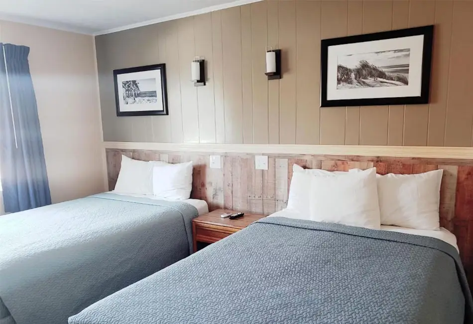 Two double beds in an oceanfront guest room at Colonial Inn