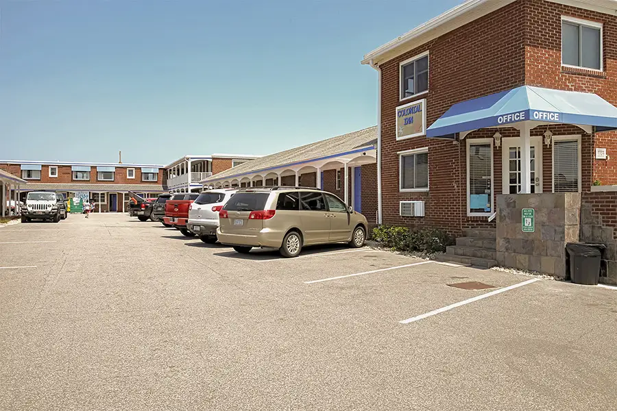 The motel office with its blue awning, and the car park in front